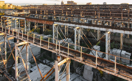 The beams and supports of the travelling crane warehouse concrete products under the open skyの写真素材