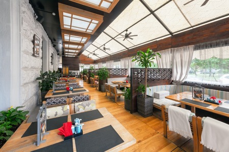MOSCOW - AUGUST 2014: Interior of the Japanese restaurant "SEIJI" in the traditional style. Covered veranda with tables, sofas and partitionsのeditorial素材