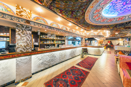 MOSCOW - AUGUST 2014: Interior Chaihana Lounge Eastern restaurant in a traditional style. The main hall with bar and open kitchenのeditorial素材