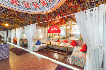 MOSCOW - AUGUST 2014: Interior Chaihana Lounge Eastern restaurant in a traditional style. Cozy private cabin in oriental styleのeditorial素材