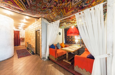 MOSCOW - AUGUST 2014: Interior Chaihana Lounge Eastern restaurant in a traditional style. Cozy private cabin in oriental styleのeditorial素材