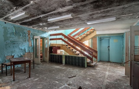 Hall with stairs in the abandoned building of the children's health campの写真素材