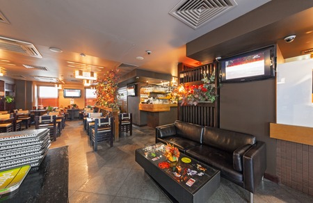 MOSCOW - SEPTEMBER 2014: Interior of the Modern Japanese restaurant "Yakitoriya" decorated in the autumn theme. The main hall insideのeditorial素材