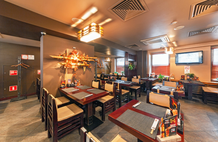 MOSCOW - SEPTEMBER 2014: Interior of the Modern Japanese restaurant "Yakitoriya" decorated in the autumn theme. The main hall insideのeditorial素材