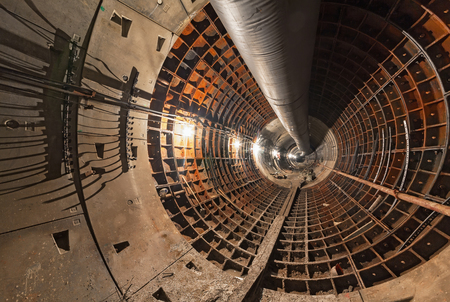 Empty tunnel under construction for the underground metro tunnel. Large temporary pipeの写真素材