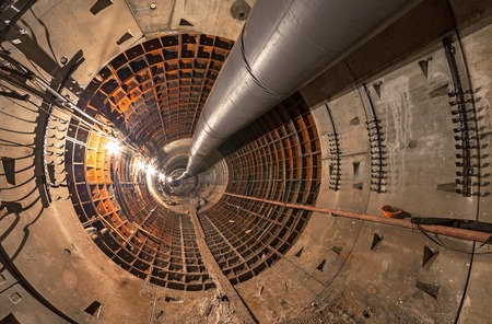 Empty tunnel under construction for the underground metro tunnel. Large temporary pipeの写真素材