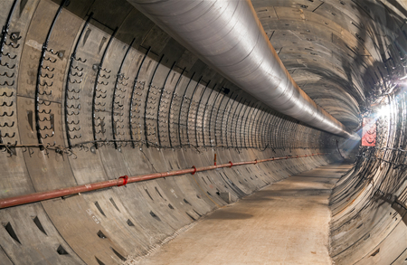 Construction of the underground metro tunnel. Turn the tunnelの写真素材