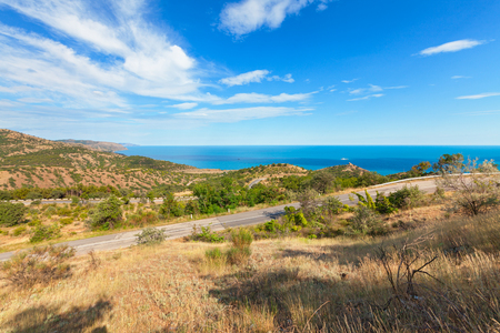The road through the hills near the coast. The Peninsula of the Crimea, the Black sea coastの写真素材