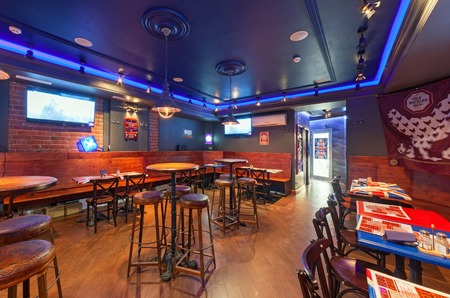 MOSCOW - AUGUST 2014: The interior is traditional British pub "Union Jack". Room with high bar tables and chairsのeditorial素材