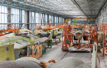 MOSCOW - JUNE 2011: Aviation factory of military aircraft - RSK MIG. Assembly of the Russian multirole fighter. Room with several planesのeditorial素材