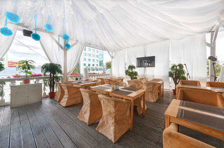 MOSCOW - AUGUST 2014: The interior of the restaurant "IBERIA HOUSE". The veranda under the tent on the upper level of the restaurantのeditorial素材