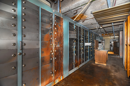 Rusty old-age deposit bank cells. The concept of financial crisisの写真素材