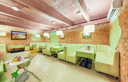 MOSCOW - AUGUST 2014: Interior of network inexpensive restaurant of Italian cuisine - "DA PINO". The hall the loft decorated in styleのeditorial素材