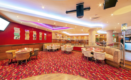 MOSCOW - SEPTEMBER 2014: Interior in modern style of the bar-restaurant "FUSION PLAZA" of Indian and European cuisine in red and beige colorのeditorial素材