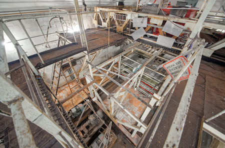 Top-down view of the broken ionization calorimeter in an abandoned underground laboratory for the study of cosmic rays. Not used installation of the 60-ies. A sign in Russian caution high voltageの写真素材