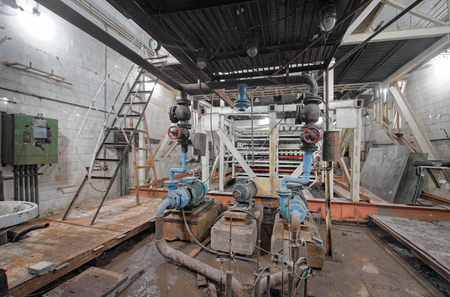 An old drainage system for pumping groundwater in a non-working underground laboratory for the study of cosmic rays.の写真素材