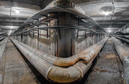 Underground concrete utility tunnel network of water supply pipeline, heat pipeline and cable vaultの写真素材