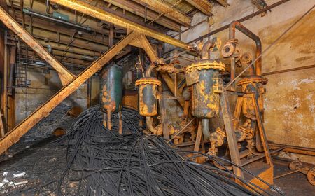 The remains of a broken old rusty industrial equipment for abandoned industrial laboratoriesの写真素材