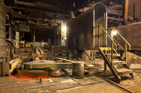 Closed lid of a vertical cast iron melting furnace in a foundryの写真素材