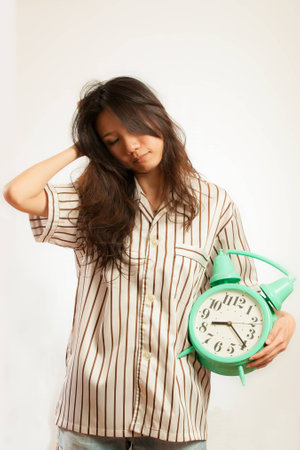 Asian woman still want to sleepの写真素材