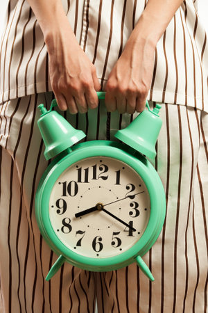 Asian woman showing the time