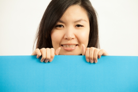 Blank card, Young woman holding card that can be replace with everything you want, namecard sign etc... shoot on isolated white backgroundの写真素材