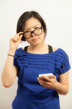 Attractive Asian working business woman shooting in isolated backgroundの写真素材