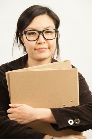 Attractive Asian working business woman shooting in isolated backgroundの写真素材