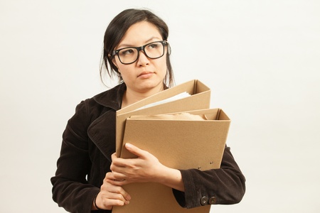 Attractive Asian working business woman shooting in isolated backgroundの写真素材