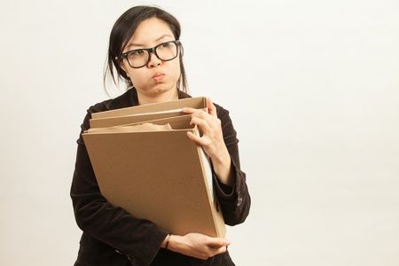 Attractive Asian working business woman shooting in isolated backgroundの写真素材