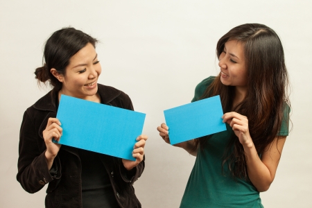 Blank card, Young woman holding card that can be replace with everything you want, namecard sign etc... shoot on isolated white backgroundの写真素材