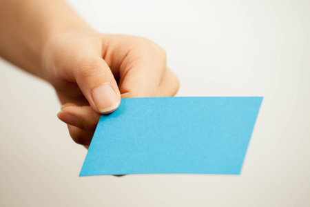 Blank card, Young woman holding card that can be replace with everything you want, namecard sign etc... shoot on isolated white backgroundの写真素材