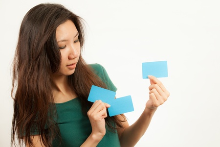 Blank card, Young woman holding card that can be replace with everything you want, namecard sign etc... shoot on isolated white backgroundの写真素材