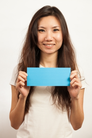 Blank card, Young woman holding card that can be replace with everything you want, namecard sign etc... shoot on isolated white backgroundの写真素材