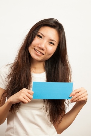 Blank card, Young woman holding card that can be replace with everything you want, namecard sign etc... shoot on isolated white backgroundの写真素材
