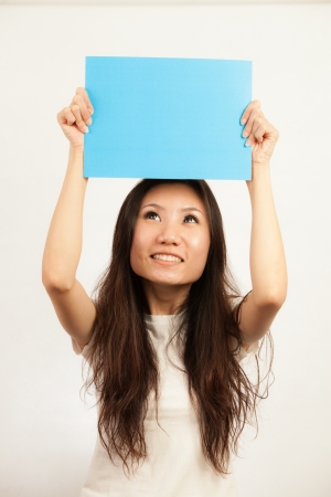 Blank card, Young woman holding card that can be replace with everything you want, namecard sign etc... shoot on isolated white backgroundの写真素材