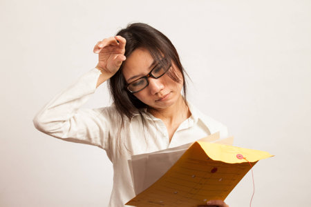 Attractive Asian working business woman shooting in isolated backgroundの写真素材
