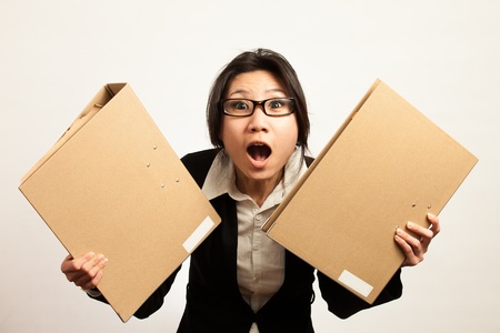 Attractive Asian working business woman shooting in isolated backgroundの写真素材