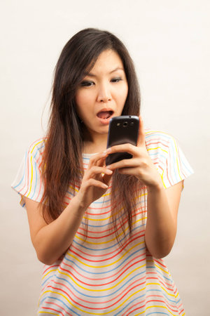 Young Asian woman woman text messagingの写真素材