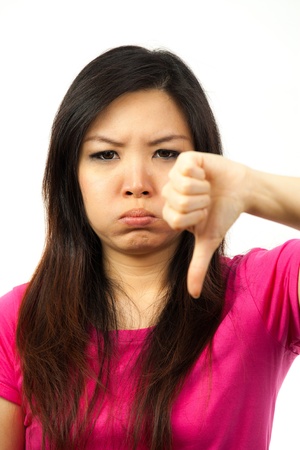 Beautiful asian woman showing hand signの写真素材