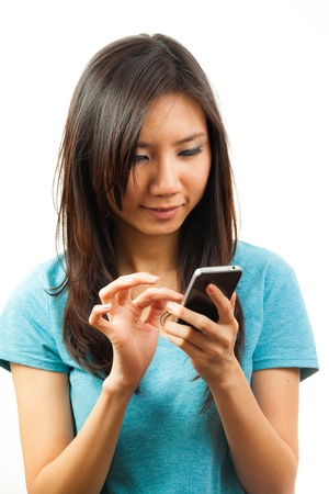 Beautiful asian woman holding a mobile phoneの写真素材