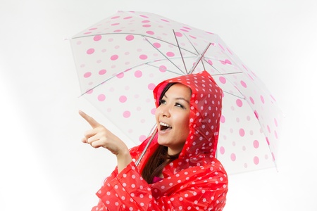 Asian women under the rain with an umbrellaの写真素材
