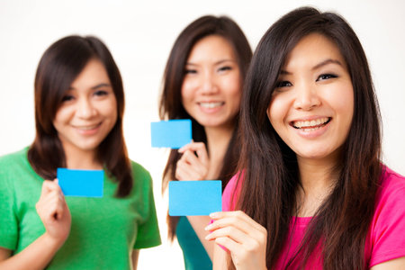 Blank card, people holding card that can be replace with everything you want, namecard sign etc    shoot on isolated white backgroundの写真素材