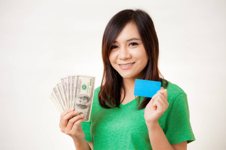 Happy Asian woman happy when making money with this card