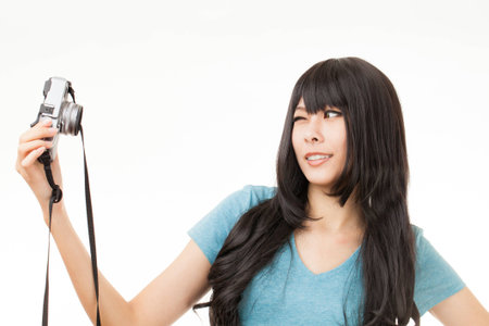 Asian woman having fun with her camera