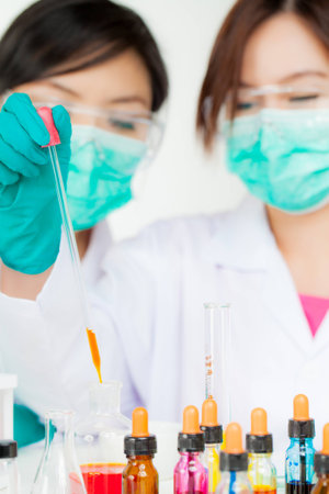 Asian researcher working with chemicalsの写真素材