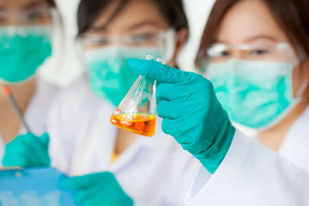 Asian researcher working with chemicalsの写真素材