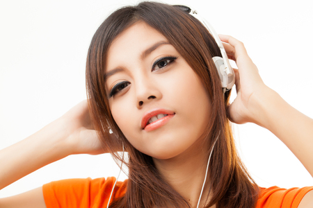 Young Asian woman with a audiophile Headphoneの写真素材