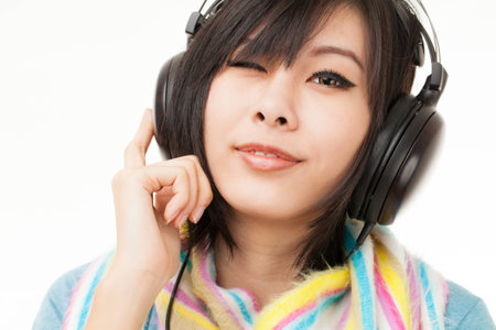 Young Asian woman with a audiophile Headphoneの写真素材