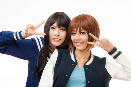 Asian playing cosplay in Japanese student uniformの写真素材